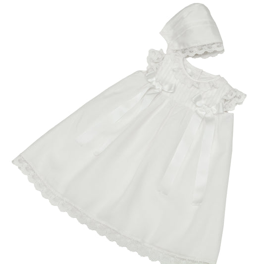 Ropón de seda con puntas de tul bordado y moños en talle